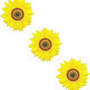 Könnte beinhalten: Drei gestickte gelbe Sonnenblumen-Patches mit braunen Zentren.