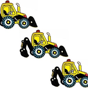 May include: Three yellow toy construction vehicles with black arms and blue wheels. The vehicles have a red light on top and a black window.