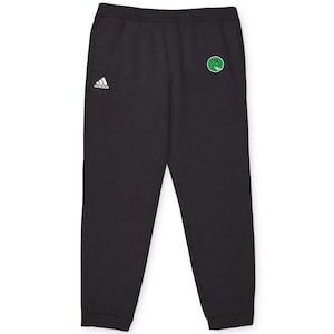 May include: Black sweatpants with a white Adidas logo on the left leg and a green and white logo on the right leg.