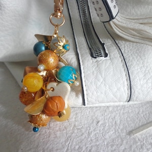 Dije para bolso, dije para monedero con cuentas, dije para monedero con pétalos, dije para bolso con flores brillantes, dije naranja, dije elegante para monedero con cuentas