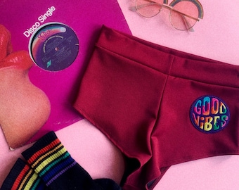 Muheeka HIGHWAIST FESTIVAL SHORTS, Burgundy with "Good Vibes" Rainbow Patch, 70s Look, Rave Clothing, Cheeky Bottoms