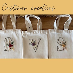 Creations from customers of the digital alphabet embroidery pattern bundle. Embroidered letters with flowers on personalized tote bags. Great for personalized DIY gifts