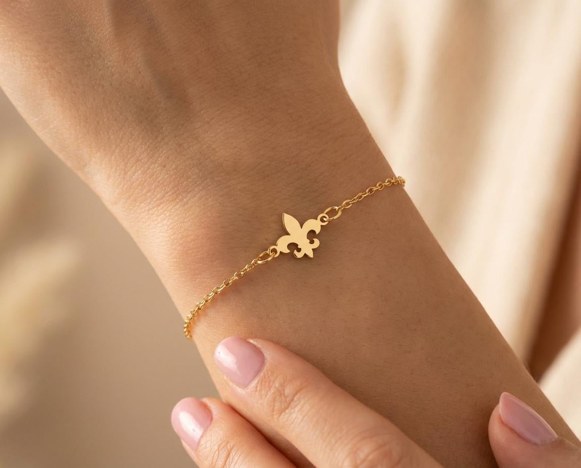 Fleur De Lis Bracelet: Gold Plated Charm Bracelet With Delicate Chain