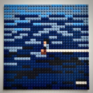 May include: A blue and black mosaic artwork depicting a stormy sea with a small figure in a boat. The artwork is made of small plastic bricks.