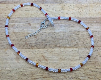 Burnt orange and red crackle bead and opaque seed bead necklace