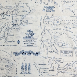 May include: A detailed map of the Thirteen Colonies, rendered in blue ink on a cream-colored background. The map includes geographical features, historical text, and illustrations of cannons and figures. The text "United We Stand" is visible.