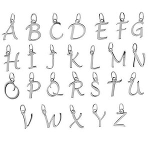 May include: A set of silver alphabet letter charms, each with a small loop for attaching to a necklace or bracelet. The letters A to Z are displayed, showcasing a variety of fonts and styles. Perfect for personalised jewellery.