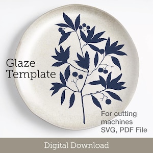 May include: A round, off-white plate with a dark blue botanical design. The plate features a branch with leaves and berries. Text on the plate reads "Glaze Template" and "For cutting machines SVG, PDF File". The words "Digital Download" are also present.