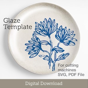 May include: A ceramic plate with a blue floral design. The plate has a cream-colored background and a dark blue flower illustration. Text on the plate reads "Glaze Template" and "For cutting machines SVG, PDF File". The words "Digital Download" are at the bottom.
