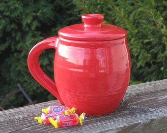 large covered mug, neon red