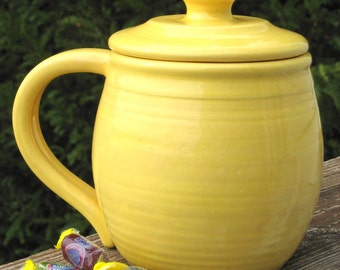 large covered mug, yellow