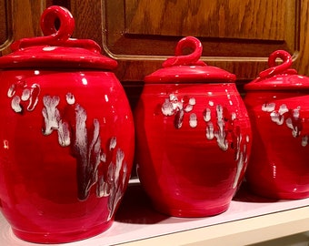 3 kitchen canisters, neon red