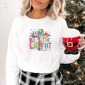 Be The Light Sweatshirt, Religious Christmas Sweatshirt, Christian Holiday Sweater, Faith Based Gift, Christmas Gifted, Festive Apparel