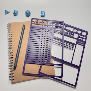 May include: Purple plastic character sheets for role-playing games, on top of a brown notebook with a grey pen. There are four blue dice on the table.