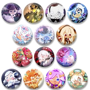 May include: A collection of twelve round pinback buttons featuring colorful cartoon character designs. The buttons showcase various characters in different poses and color schemes, with a glossy finish.
