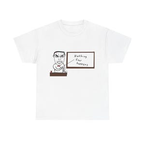 May include: A white short-sleeve t-shirt featuring a graphic illustration of a person with glasses and a red bow tie standing at a desk. A line points from the person to a chalkboard with the handwritten text "Nothing Ever happens" written on it.