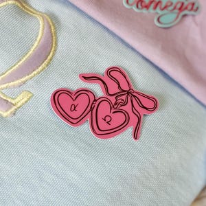 medalhão de coração coquete | alfa x ômega | adesivo omegaverse