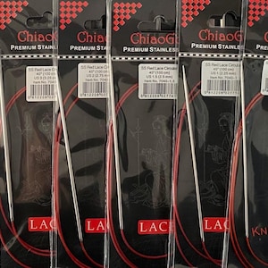 May include: Six packages of red circular knitting needles, each with a different size. The needles are made of stainless steel and are labeled with the size in US and mm. The packages are labeled "Chiaogoo Premium Stainless" and "SS Red Lace Circular".