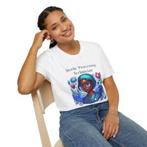 May include: White t-shirt with the text "Sterile Processing Technician" and a cartoon illustration of a woman wearing a surgical cap and scrubs.