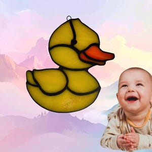 Baby Animal Duckling. Made of beautiful yellow and orange glass. Duckling represents May.