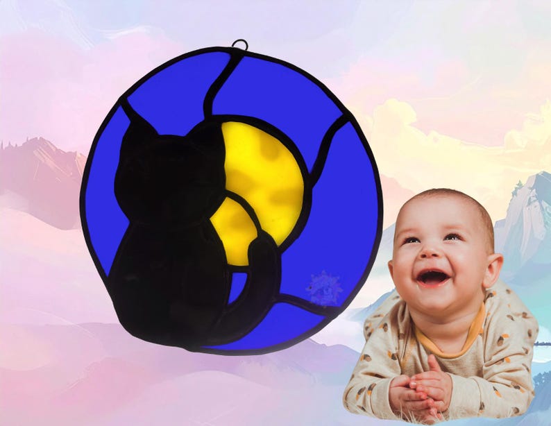 Alphabet Letter- O- shown with a Kitten for October. Letter is made with blue glass, center is yellow and kitten is black.