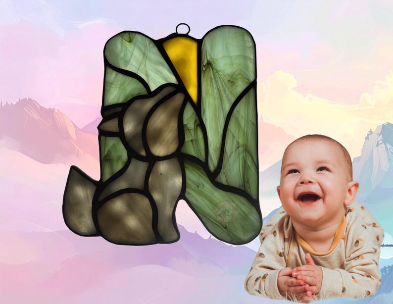 Alphabet Letter- N- show with baby wolf. Letter is made of light green, small center section is yellow (moon) and wolf is made of gray glass. Wolf represents November.