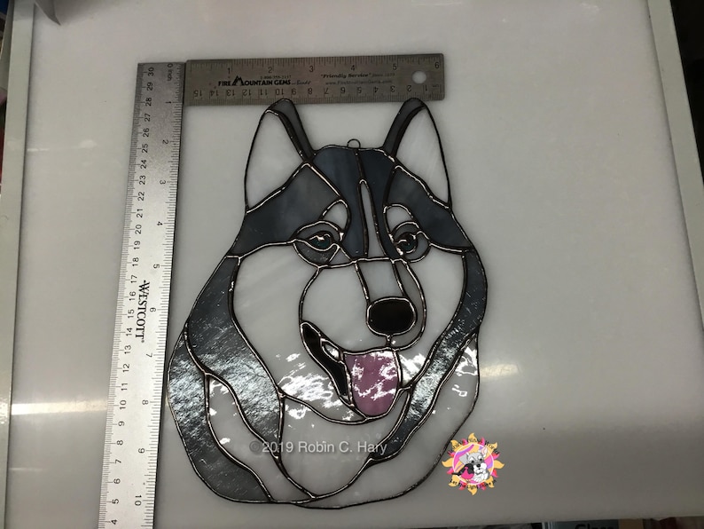 Siberian Husky Suncatcher with rulers for size reference.
