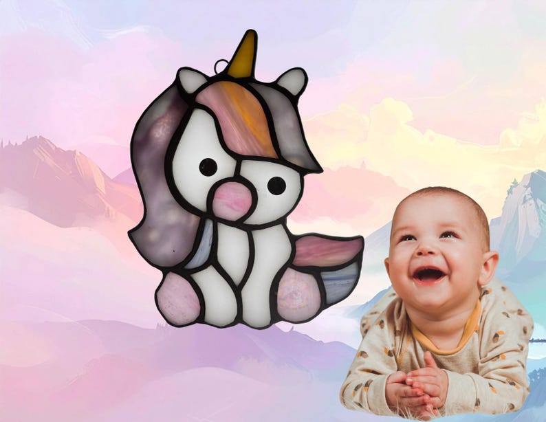 Baby Unicorn suncatcher. Made with white, pink, purple, yellow and blue glass. Unicorn represents June.