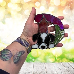 Alphabet letter- D- shown with a Puppy. Shown being held for size referents, approximately 5" at tallest point.