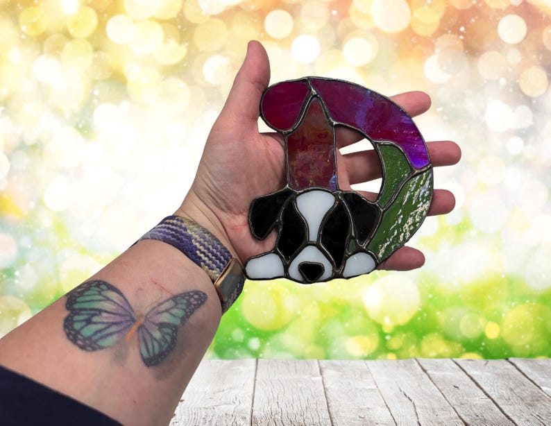 Alphabet letter- D- shown with a Puppy. Shown being held for size referents, approximately 5" at tallest point.