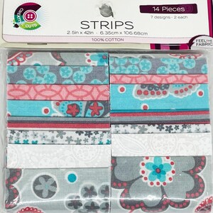 May include: A package of fabric strips with floral and geometric patterns in shades of gray, teal, pink, and white. The package contains 14 pieces, each 2.5 inches by 42 inches. The label reads "STRIPS" and "100% COTTON."