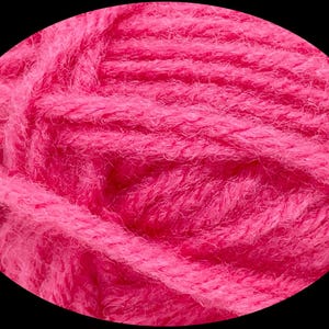 May include: Close-up of a vibrant pink yarn ball. The yarn is thick and textured, with visible strands and a soft, fuzzy appearance. The bright color suggests it's suitable for knitting or crocheting projects, adding a pop of color to crafts.