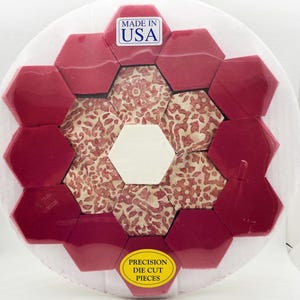 May include: A collection of red and patterned hexagon-shaped die-cut pieces arranged in a circular pattern. The pieces are packaged in clear plastic. The package includes a "Made in USA" sticker and a "Precision Die Cut Pieces" sticker.