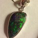 Sexy back fire filled opal pendant