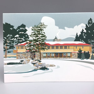 May include: A winter scene with a large, stone building with a red roof. The building is surrounded by snow-covered ground and trees.