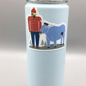 May include: A light blue reusable water bottle with a sticker of a cartoon lumberjack wearing a red and black checked shirt and a blue ox.