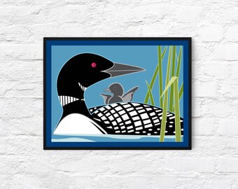 May include: A black and white loon with a pink eye and a gray chick on its back, swimming in blue water with green reeds in the background.
