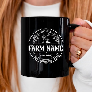 May include: Black ceramic mug with a white design featuring a chicken, the text "FARM NAME", and the words "ESTD - 2025", "FARM FRESH", "EGGS", "VEGETABLES", and "STRAW".