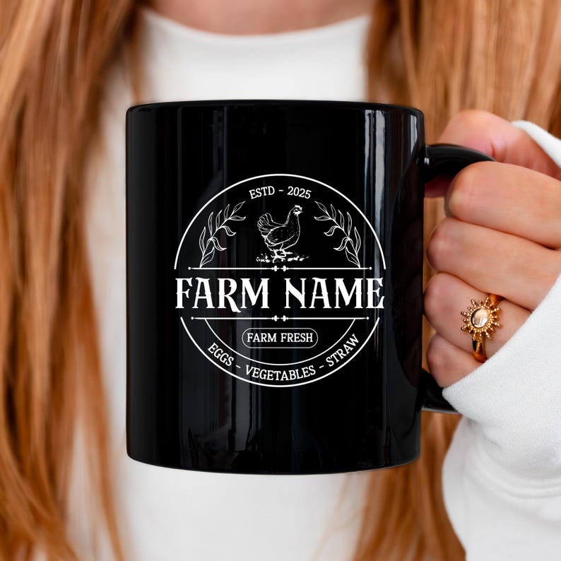 May include: Black ceramic mug with a white design featuring a chicken, the text "FARM NAME", and the words "ESTD - 2025", "FARM FRESH", "EGGS", "VEGETABLES", and "STRAW".