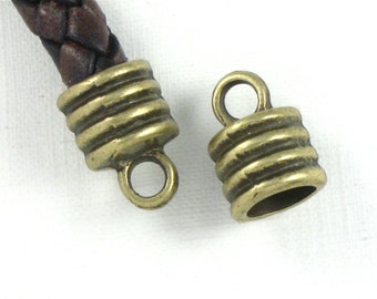 12 large antique bronze jewelry End Cap beads with loop for leather.  6.8mm inside diameter (EC7ab)