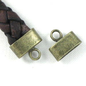 12 cord jewelry END CAPS in Antique Bronze . Large and Oval . 9mm x 3.5mm Hole (EC3ab)