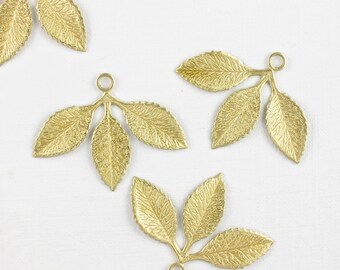 4 gold LEAVES jewelry charm pendant. Raw brass stamping. Nice leaf detail. Woodland charm. 31mm x 24mm (S29b). Please read description