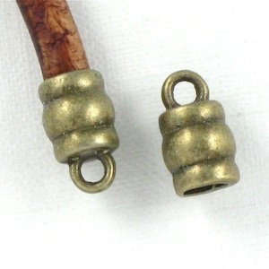 12 antique bronze leather jewelry End Caps with loop . 4mm inside diameter (EC8ab)