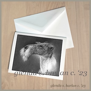 May include: Black and white pencil drawing of a Wire Fox Terrier dog's head. The dog is looking to the right and has a serious expression. The drawing is signed "Glenda S. Harlan '16" in the bottom right corner. The text "Glenda S. Harlan c. '23" is printed below the drawing.