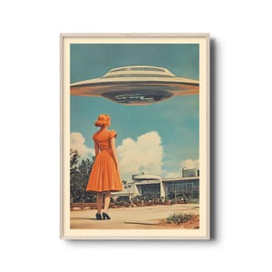 May include: A woman in a bright orange dress stands in front of a building, looking up at a flying saucer in the sky. The saucer is white with a grey underside and is hovering above the building.