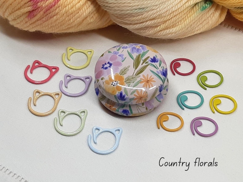 Floral stitch marker tin with stitch markers.