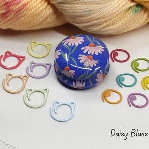 Floral stitch marker tin with stitch markers.