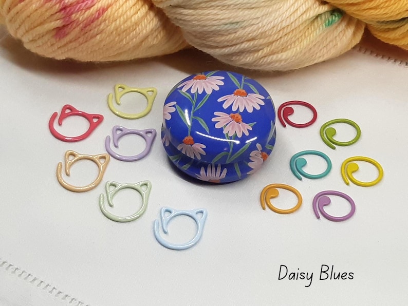 Floral stitch marker tin with stitch markers.