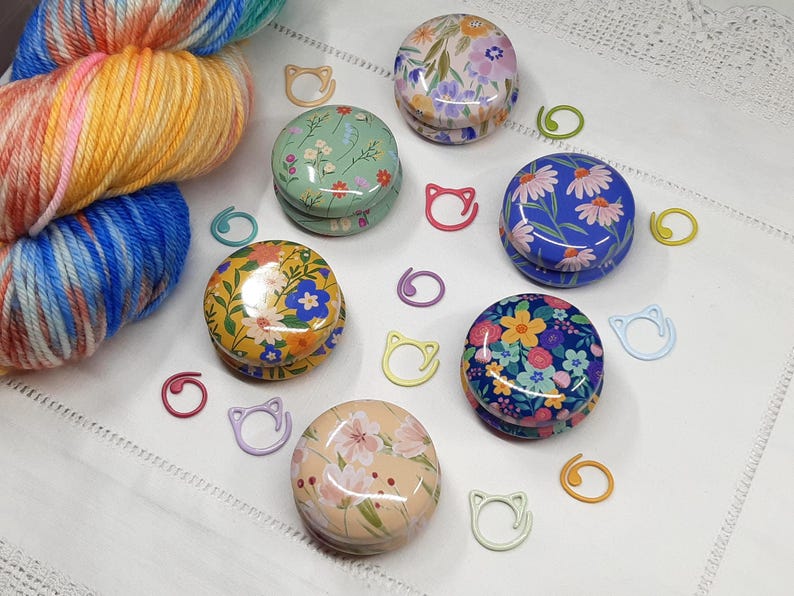 Flower stitch marker tins with metal stitch markers. Knitting and crochet notions and accessories. Gift for knitter or crocheter.