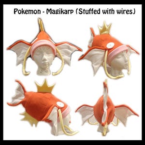 May include: A plush Magikarp hat in orange and white with yellow fins. The hat is shaped like the Pokemon Magikarp and has a crown on top. The hat is shown in four different angles.